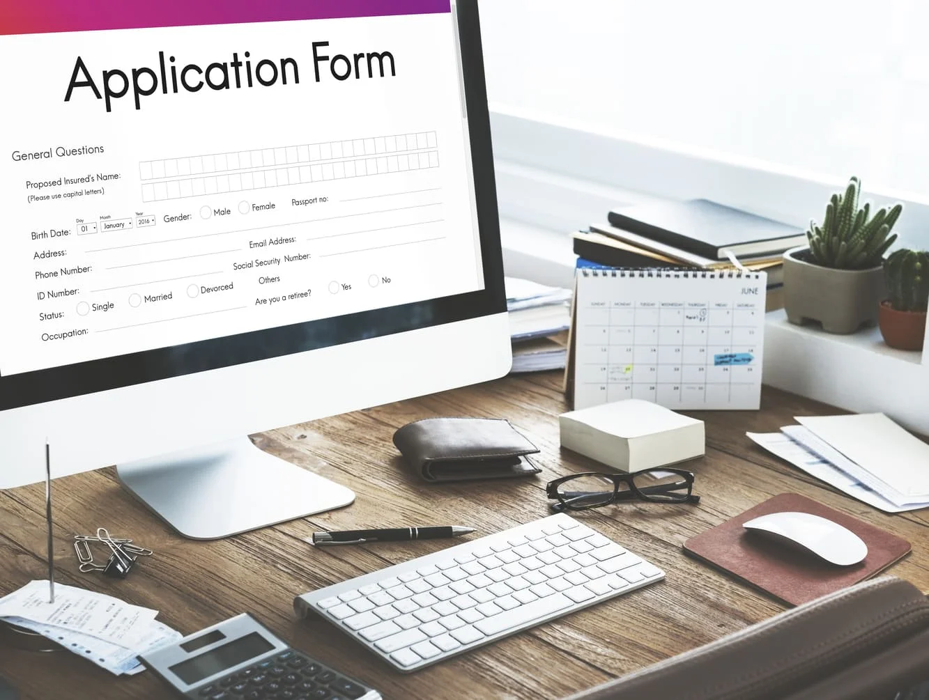 application-form-on-computer-screen-with-desk-obje application-form-on-computer-screen-with-desk-obje
