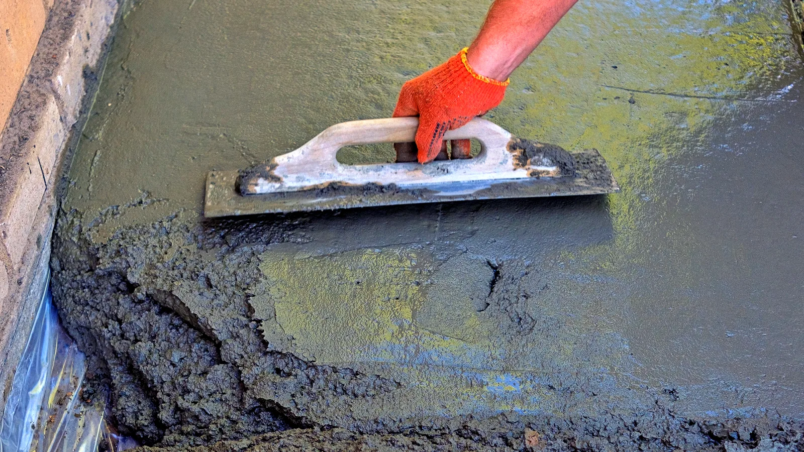 0_concrete-spreading-construction-with-orange-gloved-2026-03-17-14-39-56-utc Concrete repair in Mooresville
