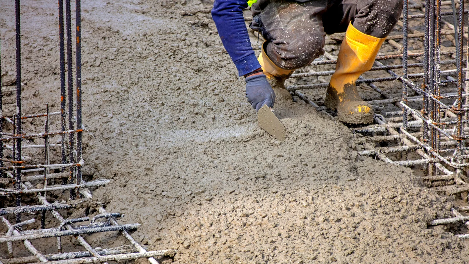 0_worker-within-safety-gear-leveling-wet-concrete-fo-2026-01-11-10-54-08-utc Concrete Foundations Mooresville