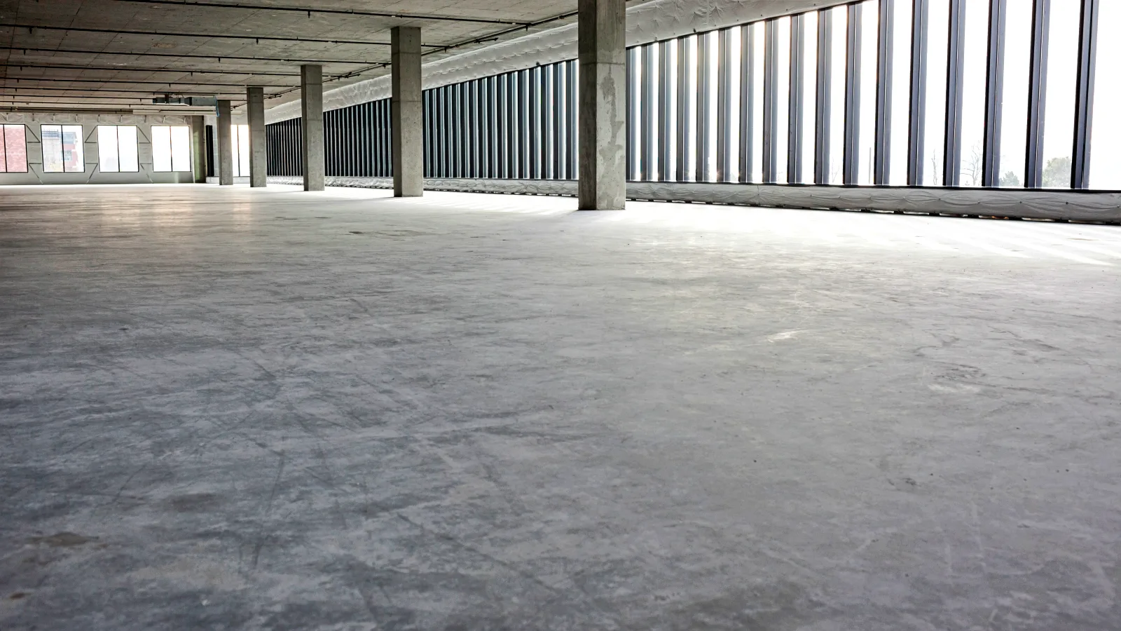 0_empty-concrete-room-with-windows-and-support-colum Concrete Installation in Harrisburg