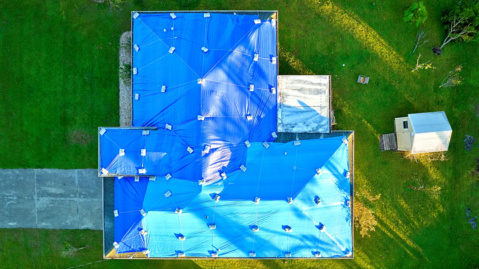 0_hurricane-ian-damaged-house-rooftop-covered-with-p-2026-03-17-07-10-42-utc Roof repair