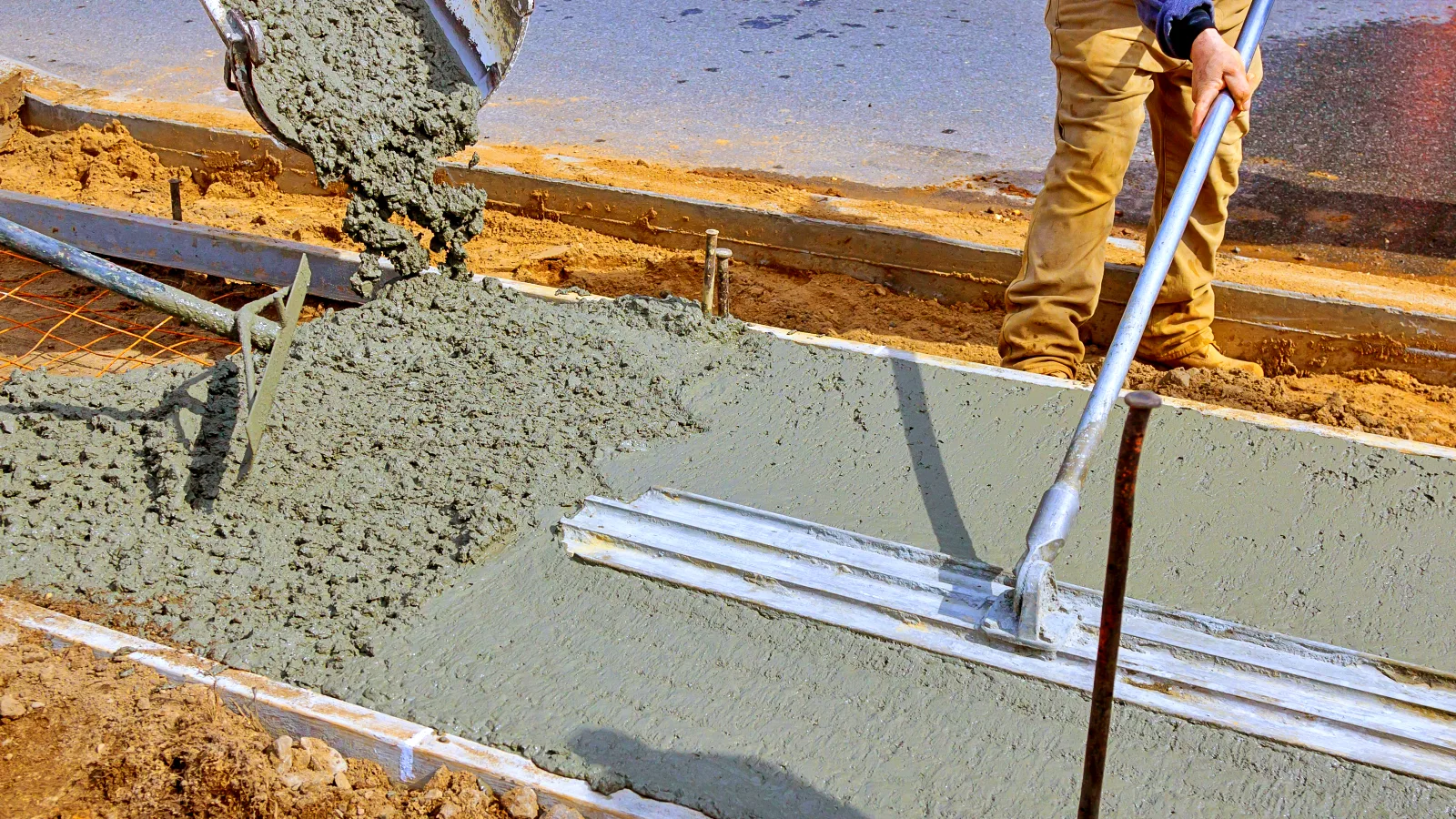 f_construction-worker-pour-cement-for-sidewalk-in-co-2026-03-25-00-37-16-utc Concrete Sidewalks in Mooresville