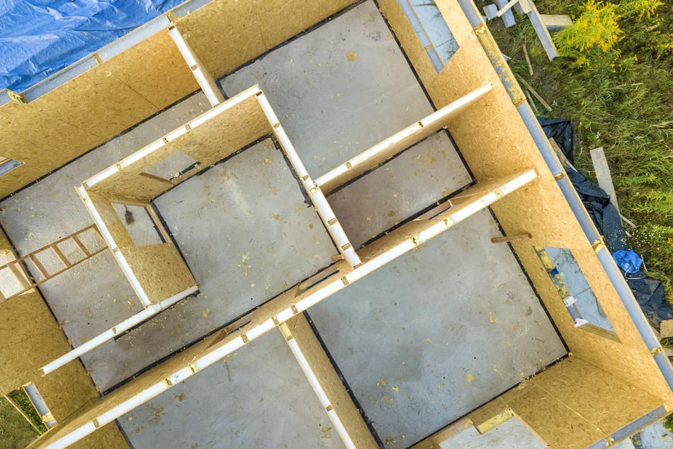 construction-site-aerial-view-of-building-foundati New Construction in Matthews NC